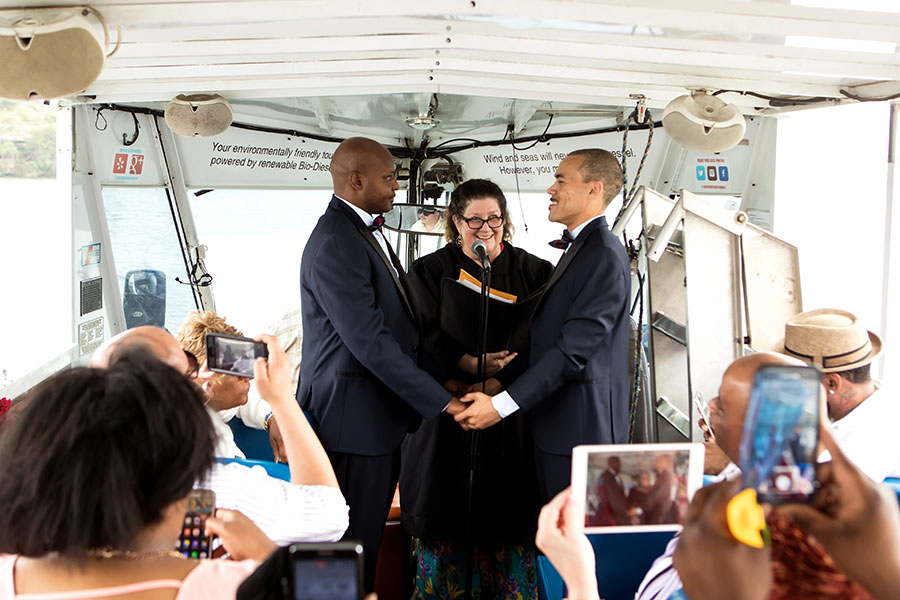 Grooms holding hands