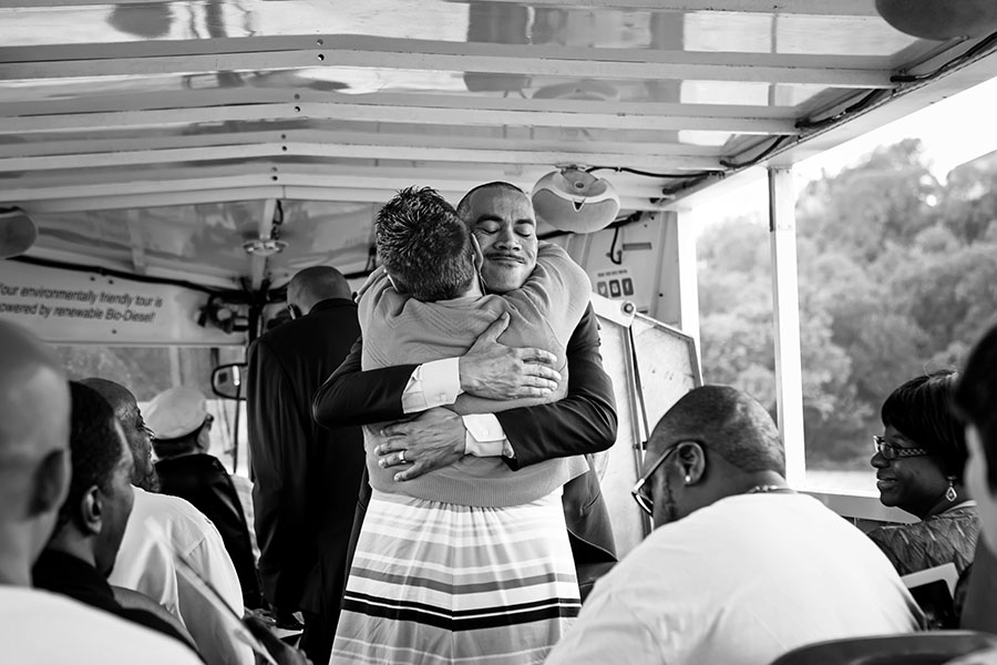 groom and mom hug